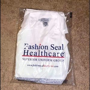 XXS short white coat. Fits more like a XS/Small unisex!